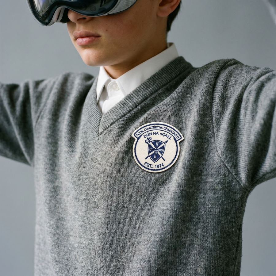 The Flydays jumper: a folded navy V-neck in a visibly soft brushed knit, a hand resting on it