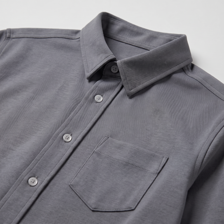 The Flydays jumper, a folded navy V-neck in a soft brushed knit